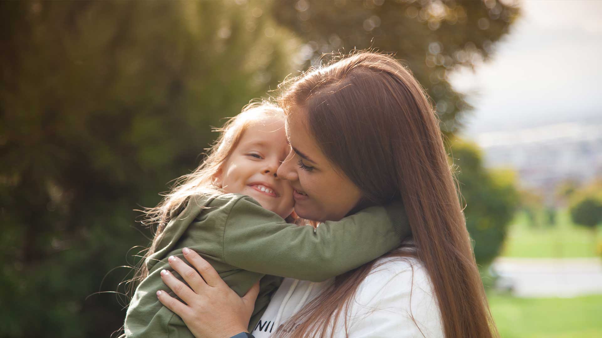 Mother holding daughter